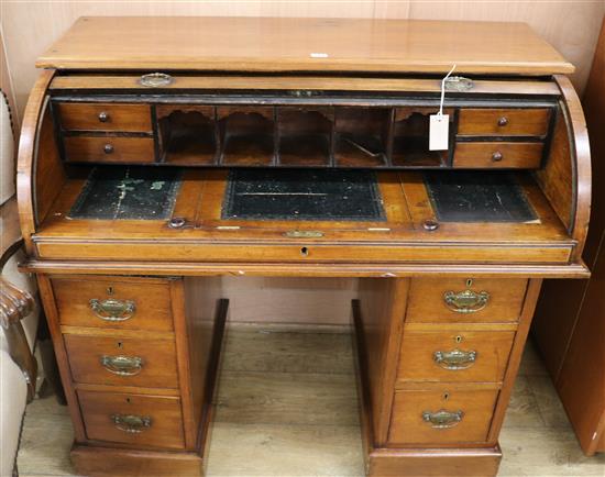 A late Victorian mahogany roll top desk, c.1870, W.107cm